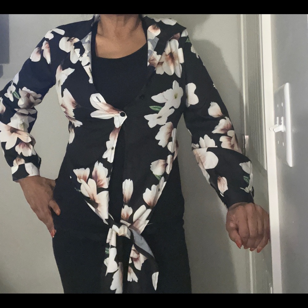 Brand new “Chic” black floral button down waist blouse